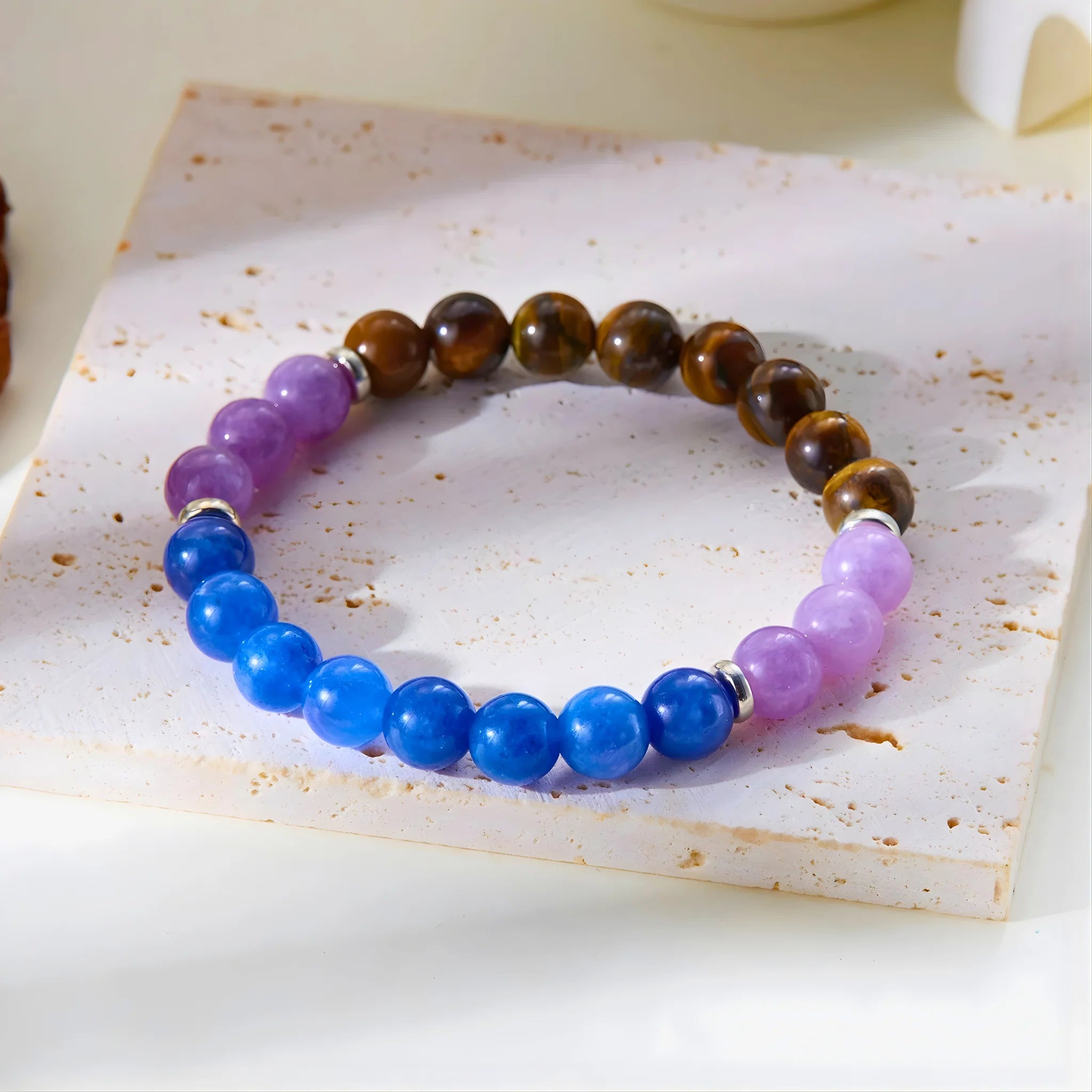 Anxiety Relief gemstone bracelet shown on stone slab for detail.