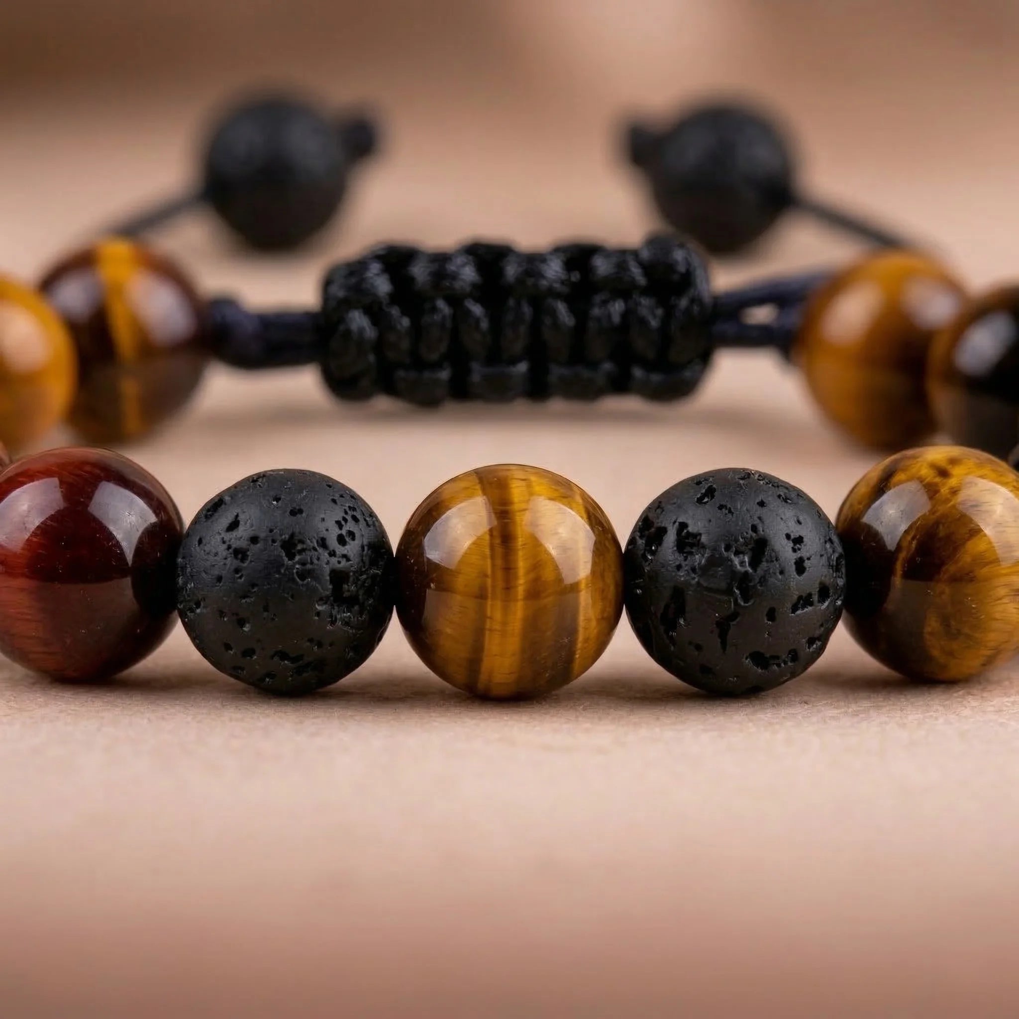 Close-up of a bracelet with multicolored beads on a neutral background