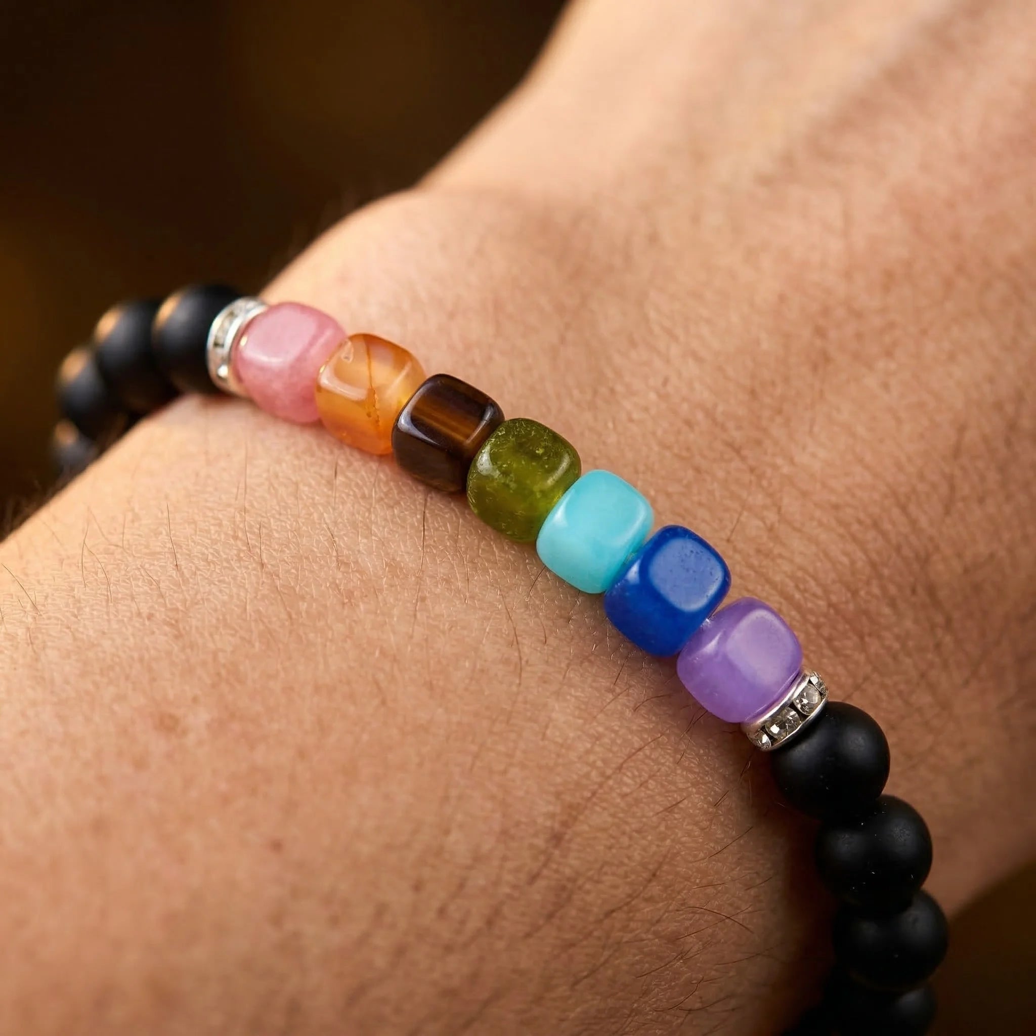 Colorful beaded bracelet on a wrist with a blurred background