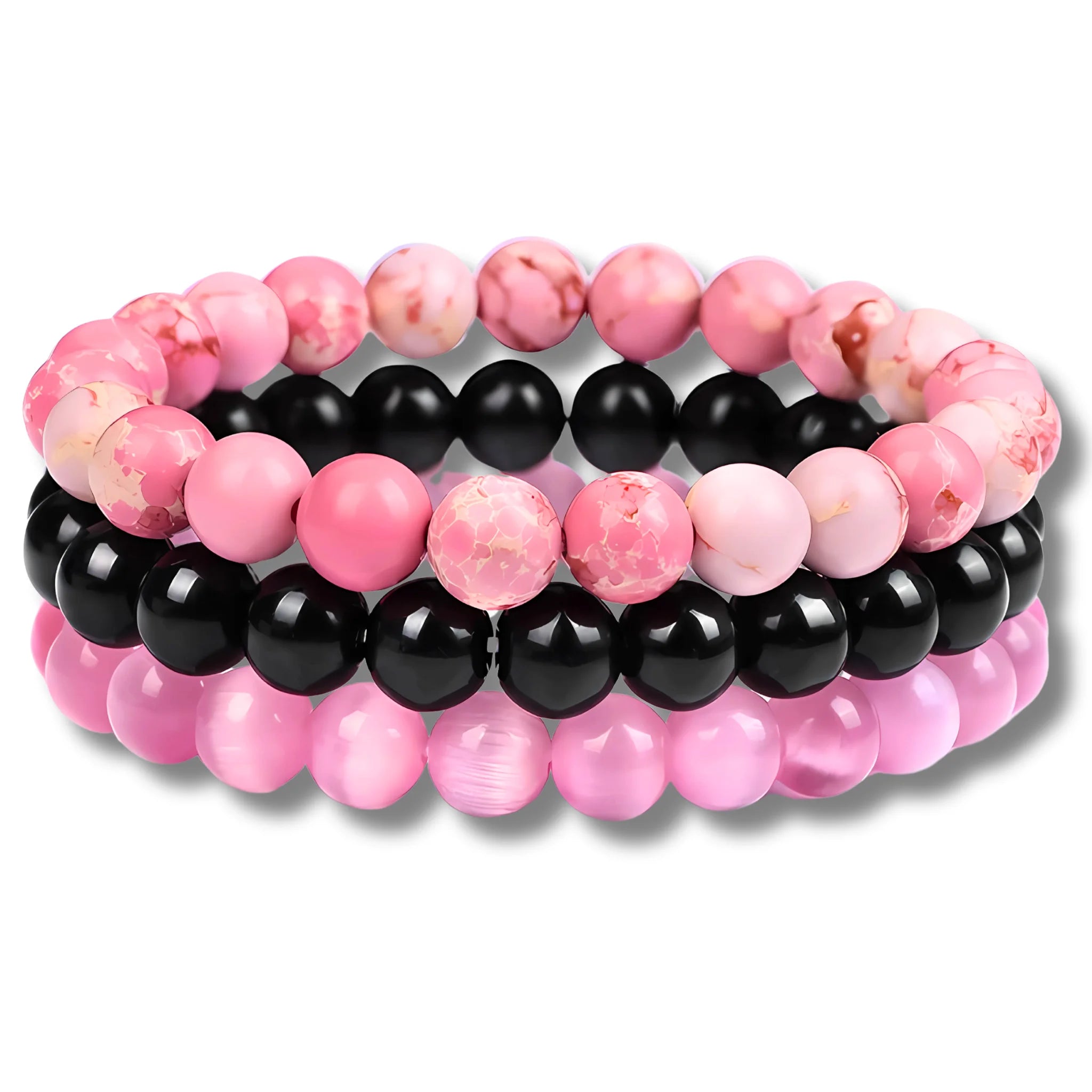 Compassionate intention bracelet stack with pink imperial jasper, black onyx, and pink cat eye beads symbolizing love and emotional warmth.