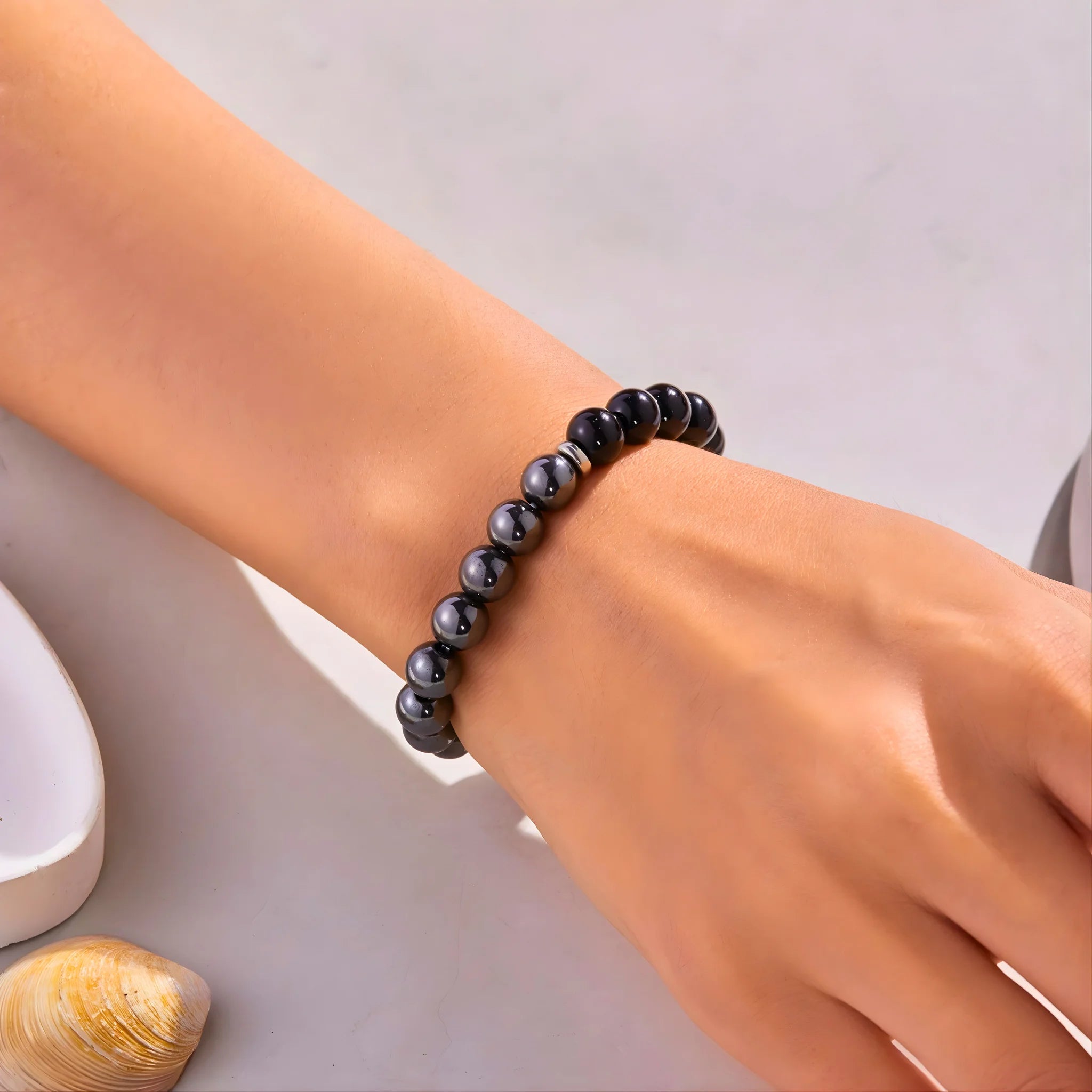 Model wearing the Protection empowerment bracelet on wrist.