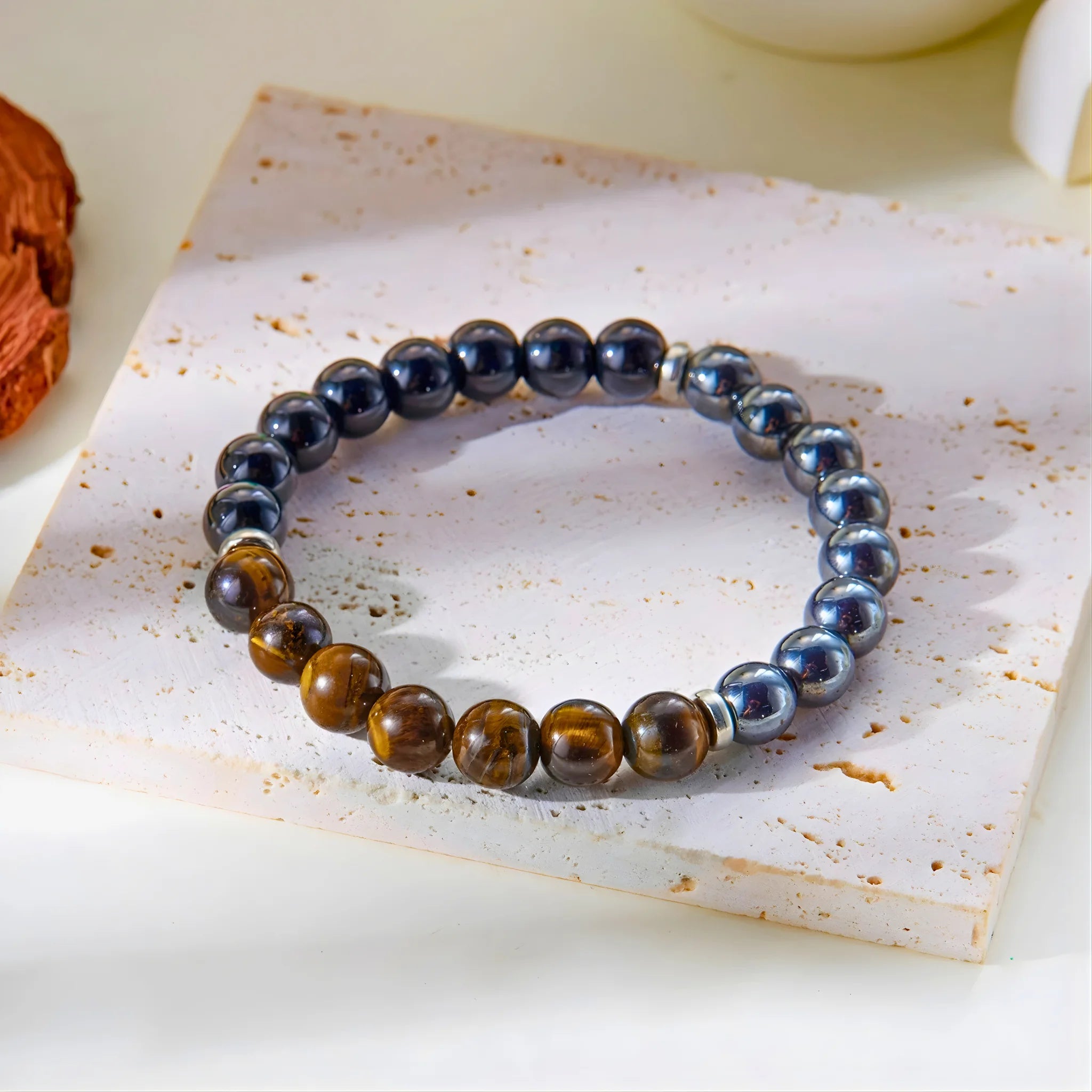 Protection gemstone bracelet styled on stone slab.